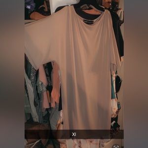 Women’s size large tan dress with the slits on the sleeves excellent condition.